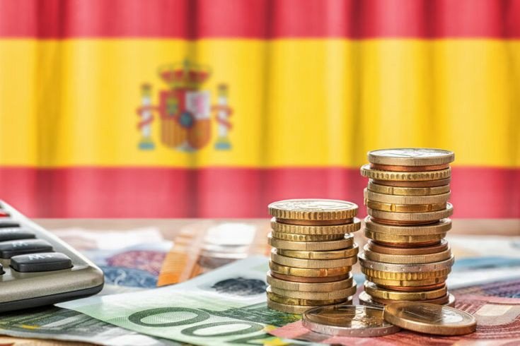 تصویر پرچم اسپانیا به همراه سکه و پول نقد برای عنوان هزینه‌‌های زندگی در اسپانیا 2023 انتخاب شده است.